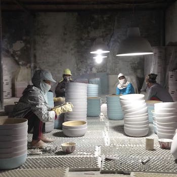spun bamboo bowls being handcrafted by artisans in a bamboo factory in Vietnam